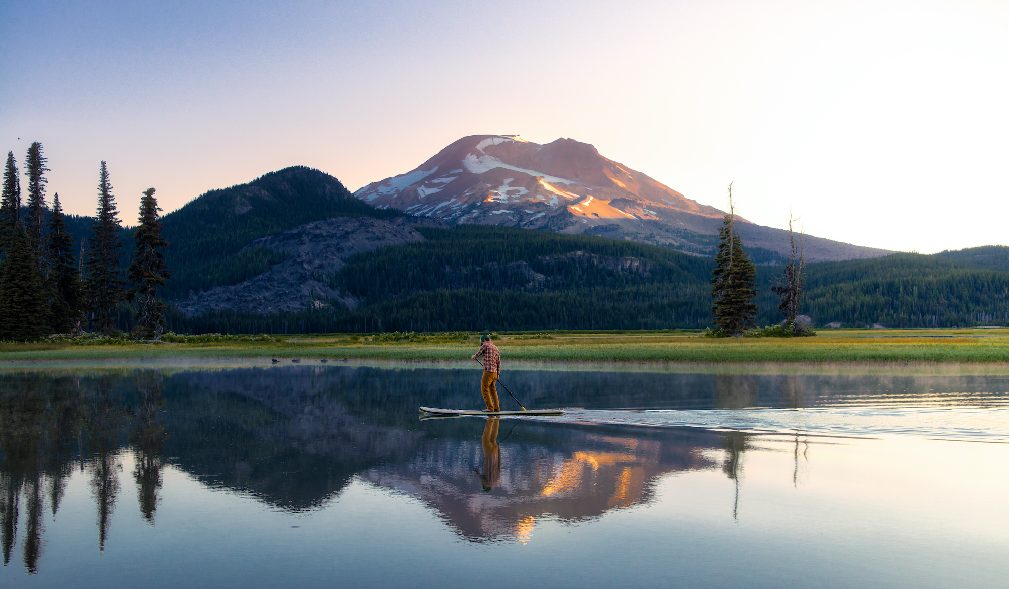 Sparks Lake in Central Oregon is a popular destination for outdoor enthusiasts, stand up paddle boarders and kayakers