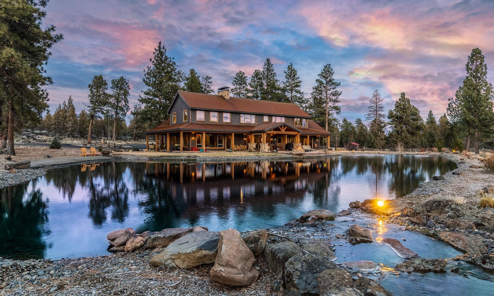 lodge style two story home on lake with colorful sky 162022402_5186459004757629_8293402448568528532_n