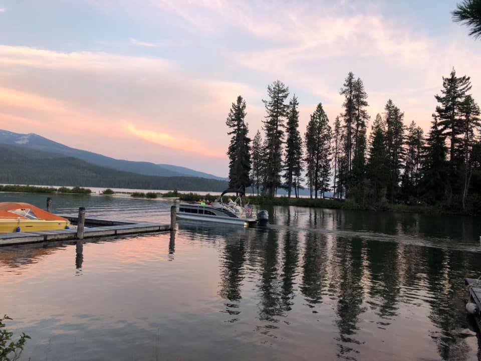 central oregon lake with boats at sunset
