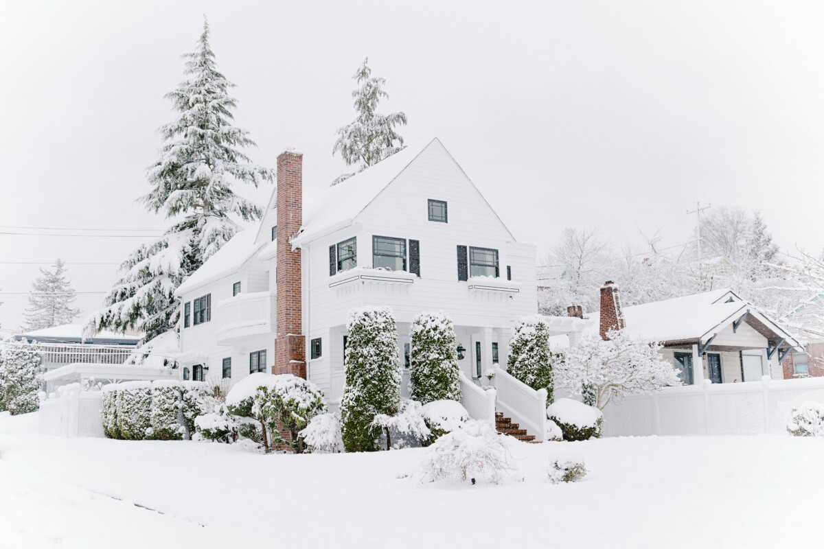 snow-covered, 2-story white, beautiful home